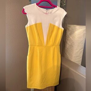 Form fitting Calvin Klein dress. With yellow bottom and white top.